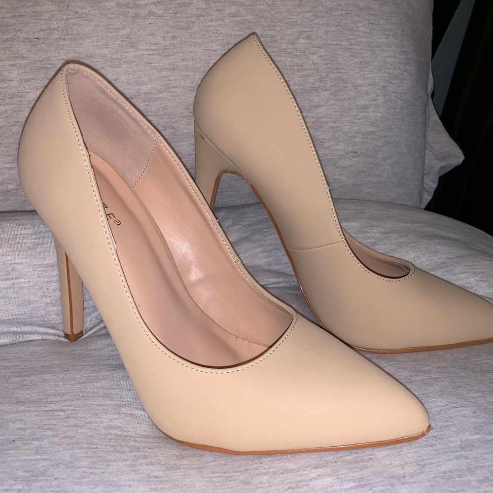 Tan pointy high heels